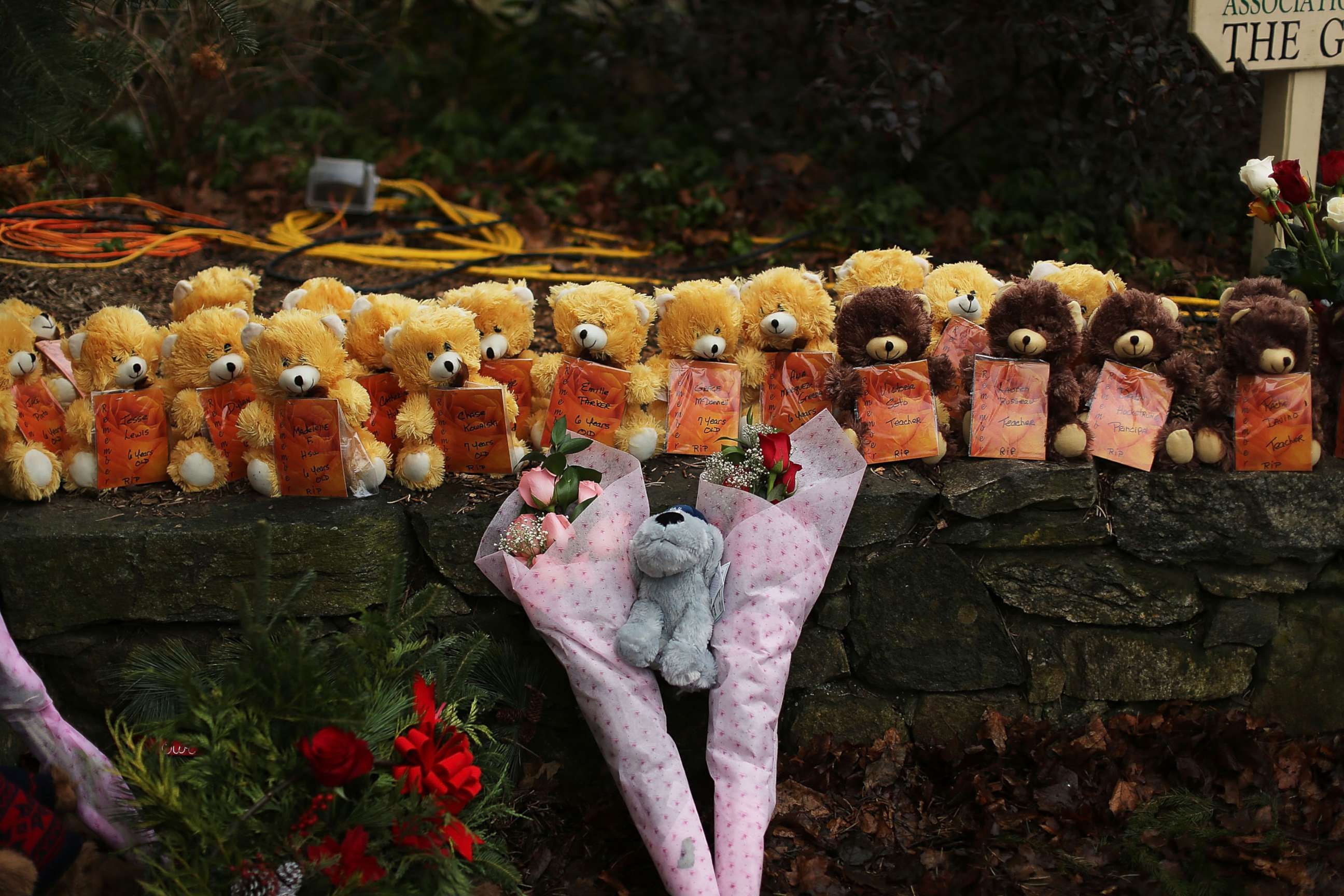 PHOTO: Teddy bears and flowers, in memory of those killed, are left at a memorial down the street from the Sandy Hook School on Dec. 16, 2012 in Newtown, Conn.