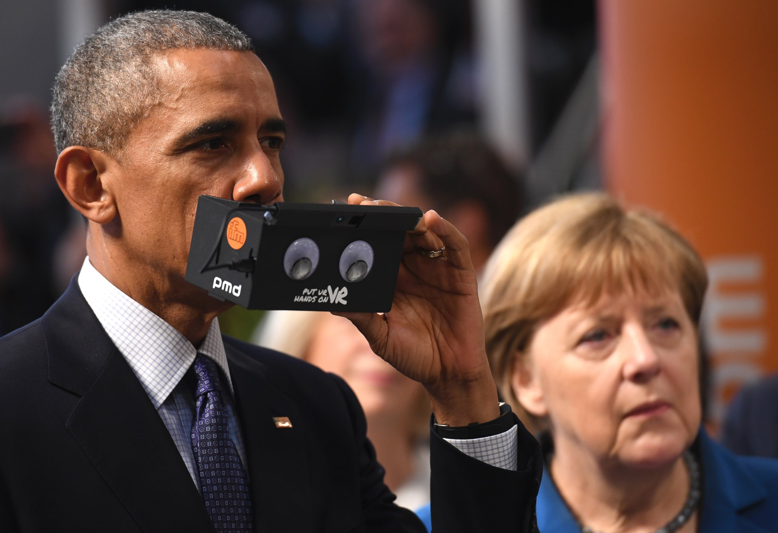 PHOTO:President Barack Obama and German Chancellor Angela Merkel visit the ifm electronics stand at the Hannover Messe industrial trade fair, April 25, 2016, in Hanover, Germany.   