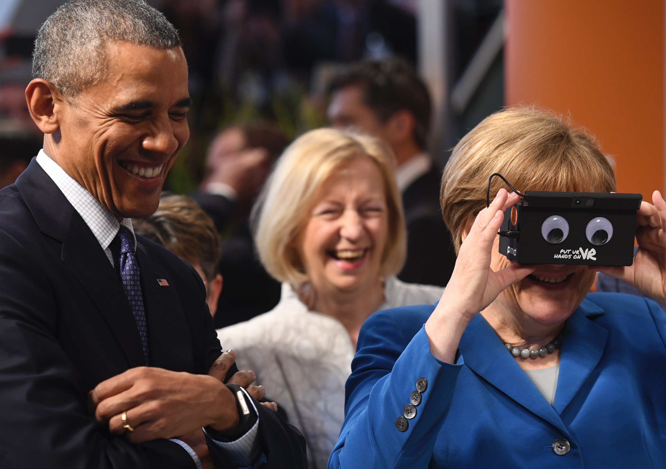 PHOTO:President Barack Obama and German Chancellor Angela Merkel visit the ifm electronics stand at the Hannover Messe industrial trade fair, April 25, 2016, in Hanover, Germany.  