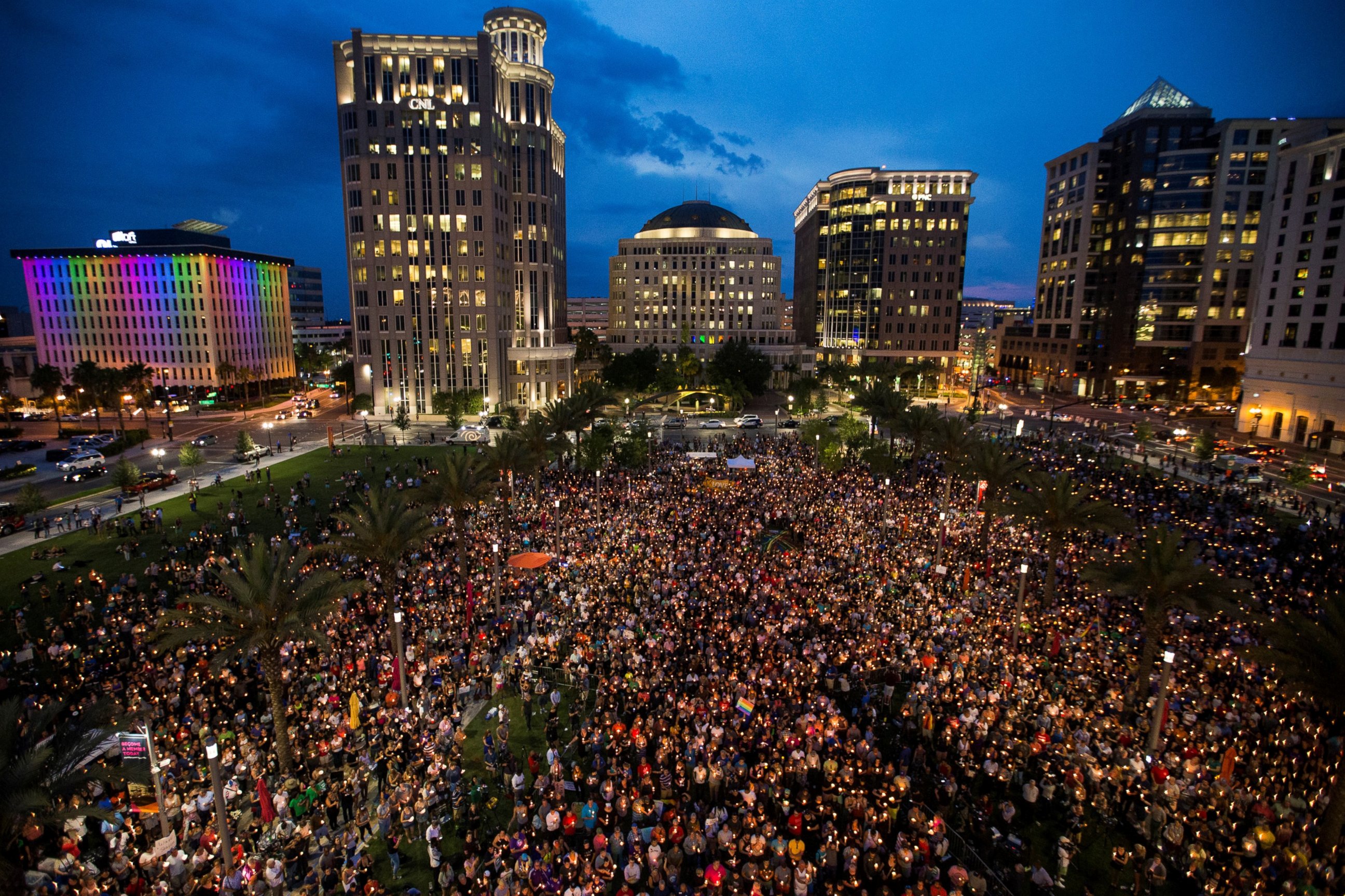 PHOTO:Thousands gather at the Dr. Phillips Center for the Performing Arts to pay their respects for those lost in the Pulse nightclub shooting in Orlando, Fla., June 13, 2016.  