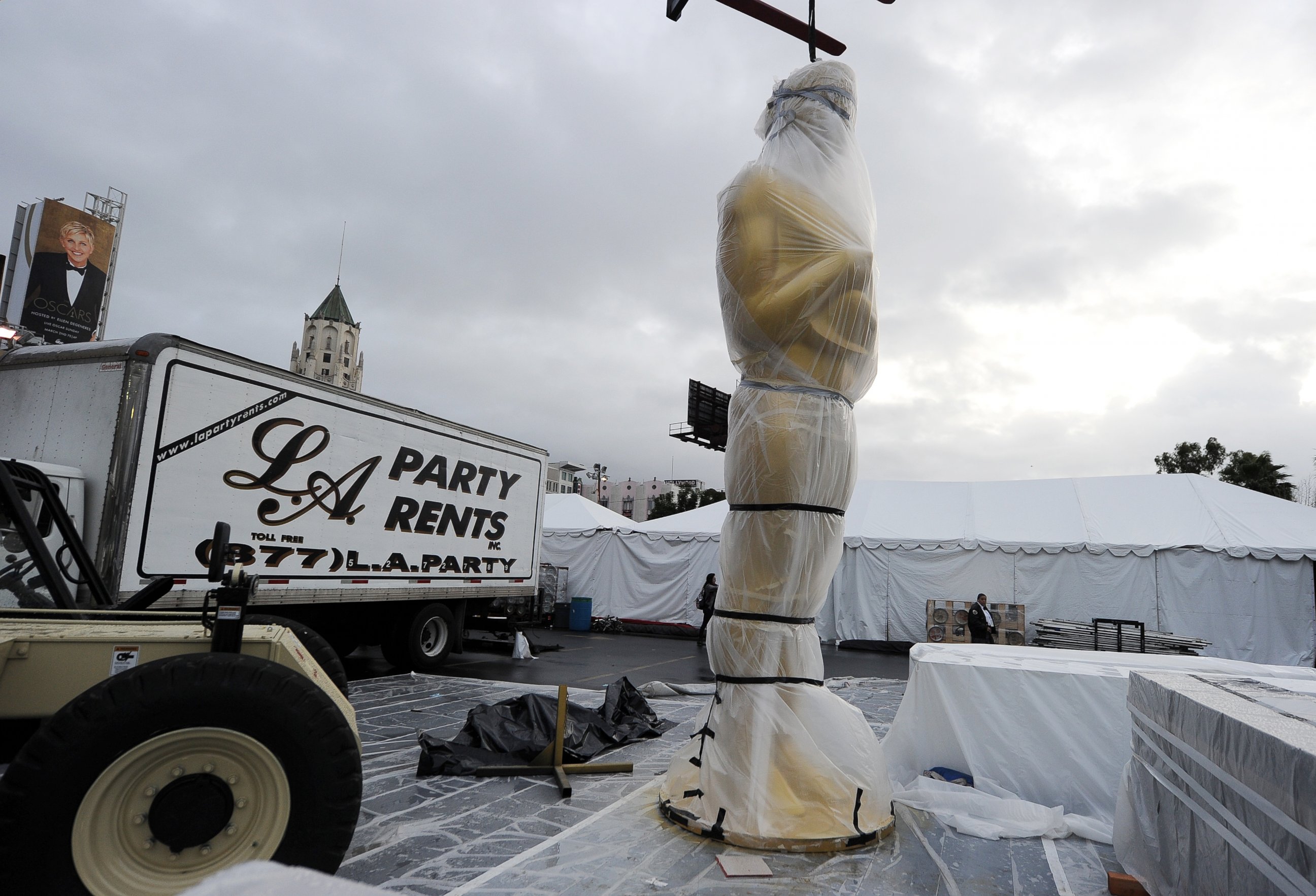 PHOTO: An Oscar statue is covered in plastic near the red carpet as preparations continue for the 86th Annual Academy Awards, March 1, 2014, in Hollywood, Calif. 