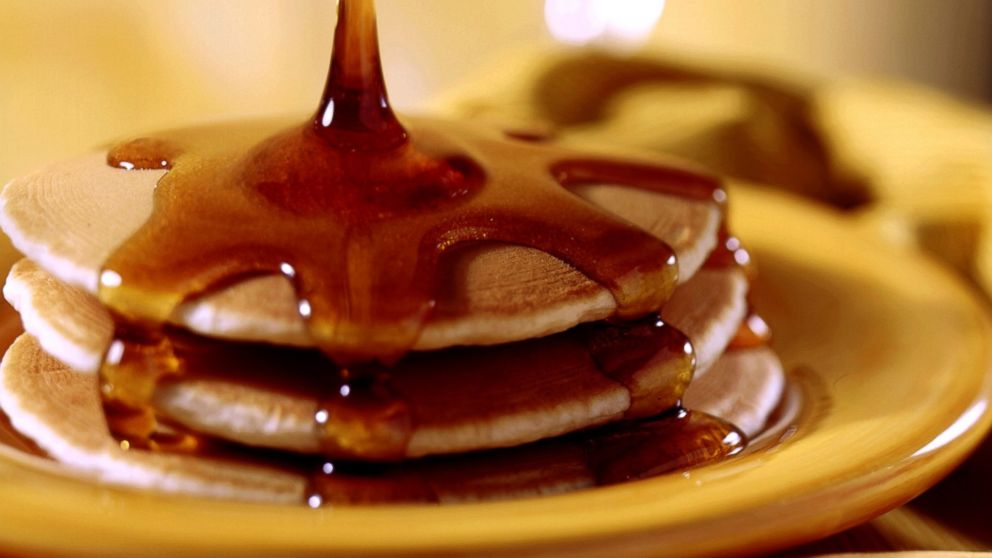 PHOTO: Pancakes topped with maple syrup.