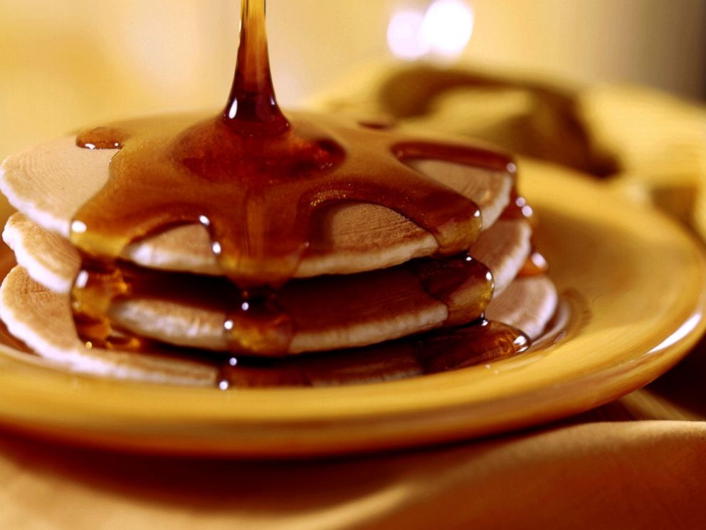 PHOTO: Pancakes topped with maple syrup.