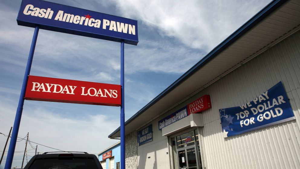 PHOTO:Signs seen at a Cash America pawn shop advertise payday loans and gold purchasing in this undated file photo.