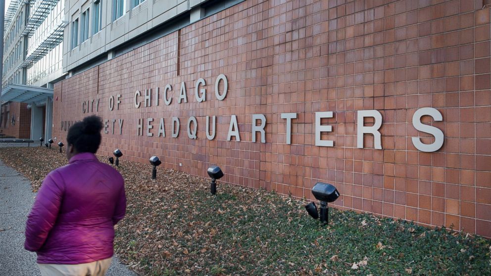 PHOTO: A woman walks past the City of Chicago Public Safety Headquarters on December 1, 2015, in Chicago. 