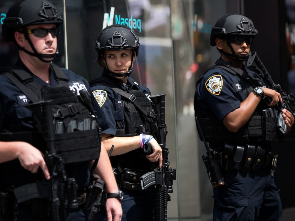 PHOTO: Members of the New York City Police Department stand guard in Times Square, July 15, 2016 in New York City.