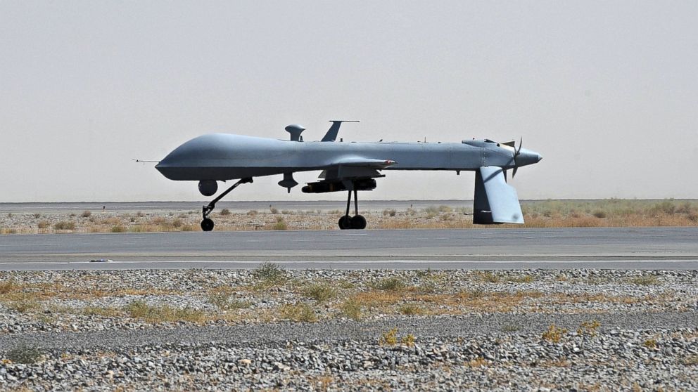 A US Predator unmanned drone armed with a missile stands on the tarmac of Kandahar military airport, June 13, 2010. 