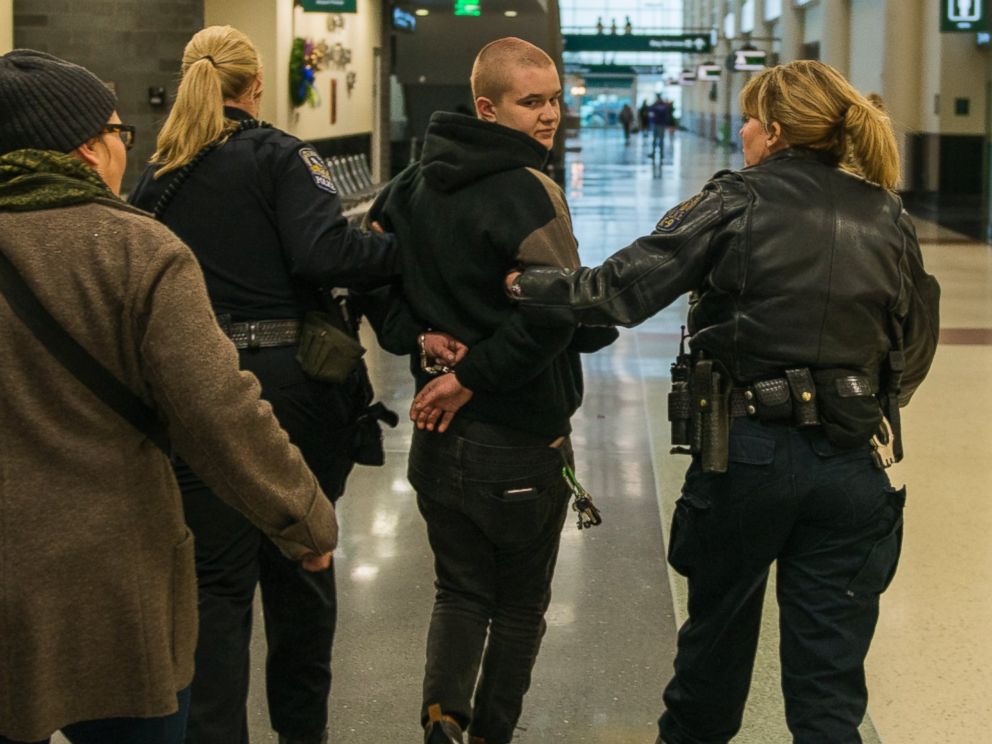 PHOTO: A woman, arrested at a Black Lives Matter protest at the Minneapolis-St. Paul International Airport, is walked by police to a detainment room, Dec. 23, 2015 in Minneapolis.