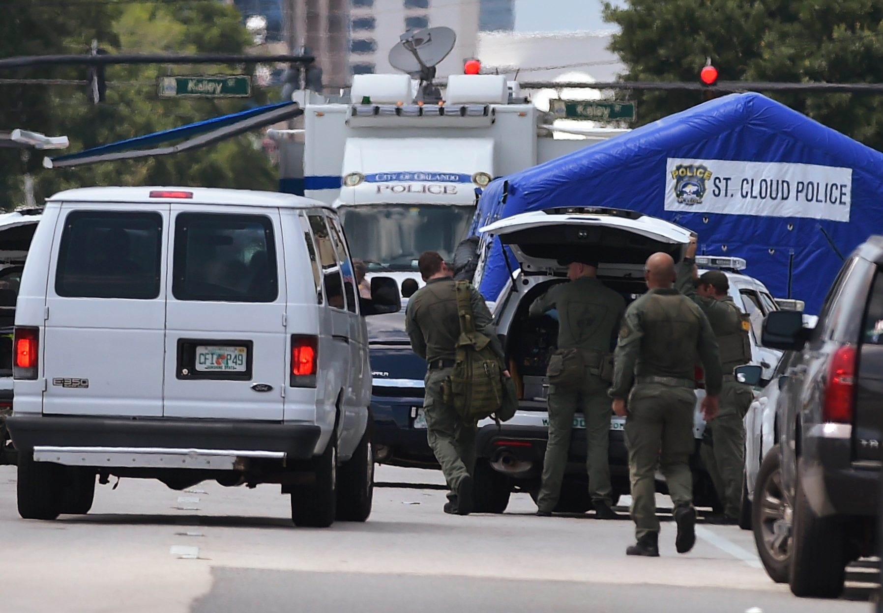 PHOTO: First responders are seen in front of a police tent near the area of the mass shooting at the Pulse nightclub in Orlando, Fla., June 12, 2016. 