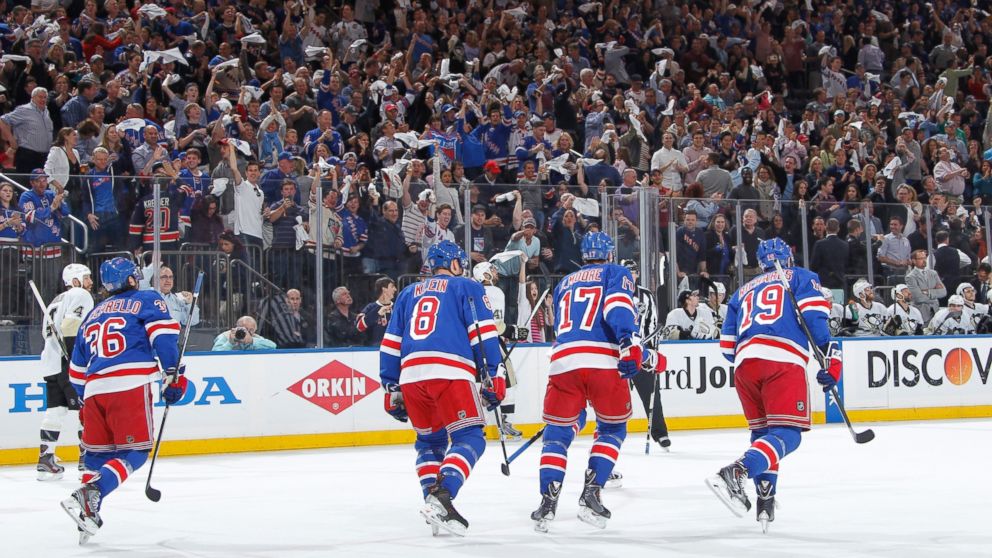 Fans cheer as the New York Rangers skate back the bench after a goal in the first period against the Pittsburgh Penguins in Game Six of the Second Round of the 2014 Stanley Cup Playoffs at Madison Square Garden on May 11, 2014 in New York City.