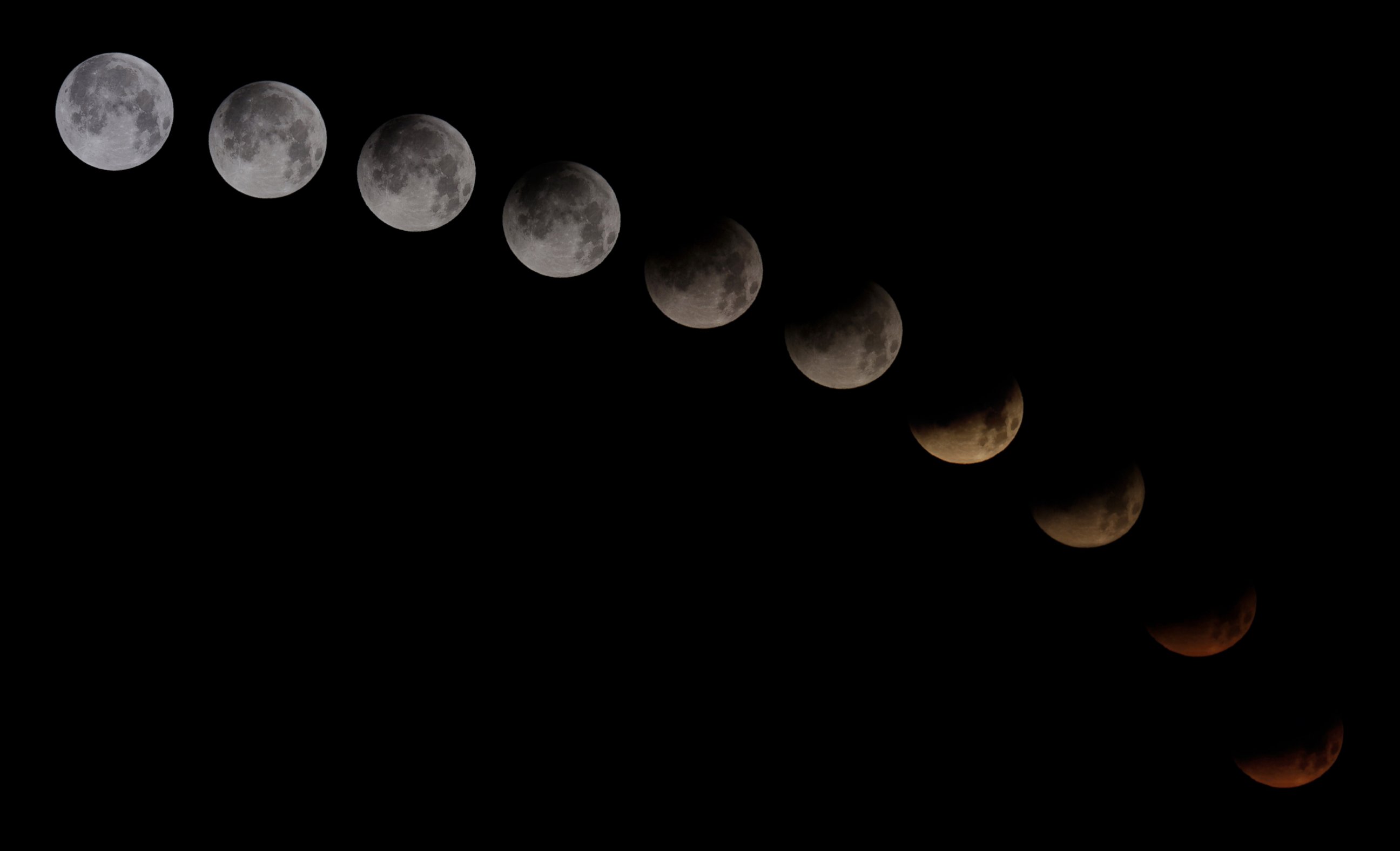 PHOTO: A combination of 10 pictures shows the moon in different stages of a total lunar eclipse seen from the Spanish Canary Island of Tenerife, April 15, 2014.