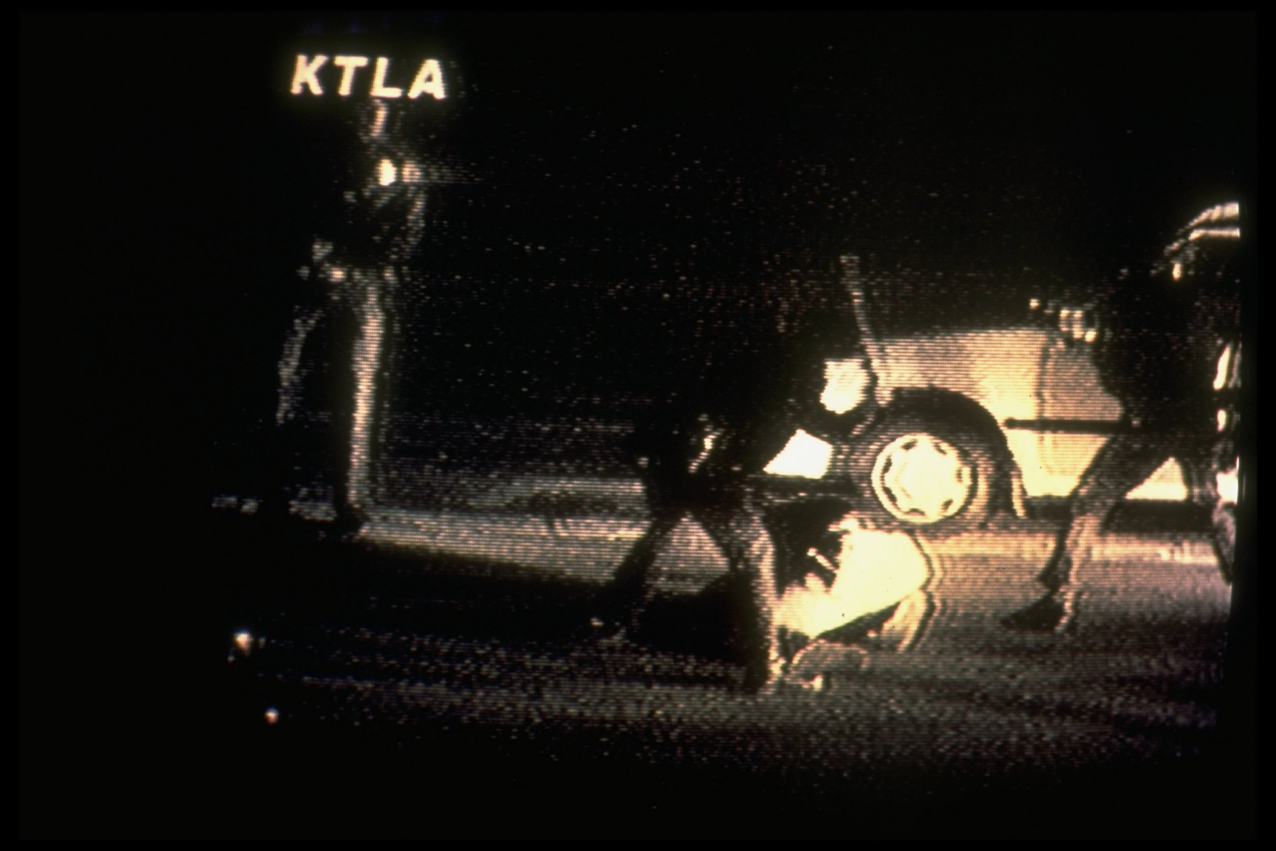 PHOTO: A video image taken by George Holliday shows police beating Rodney King as he lies on ground. 