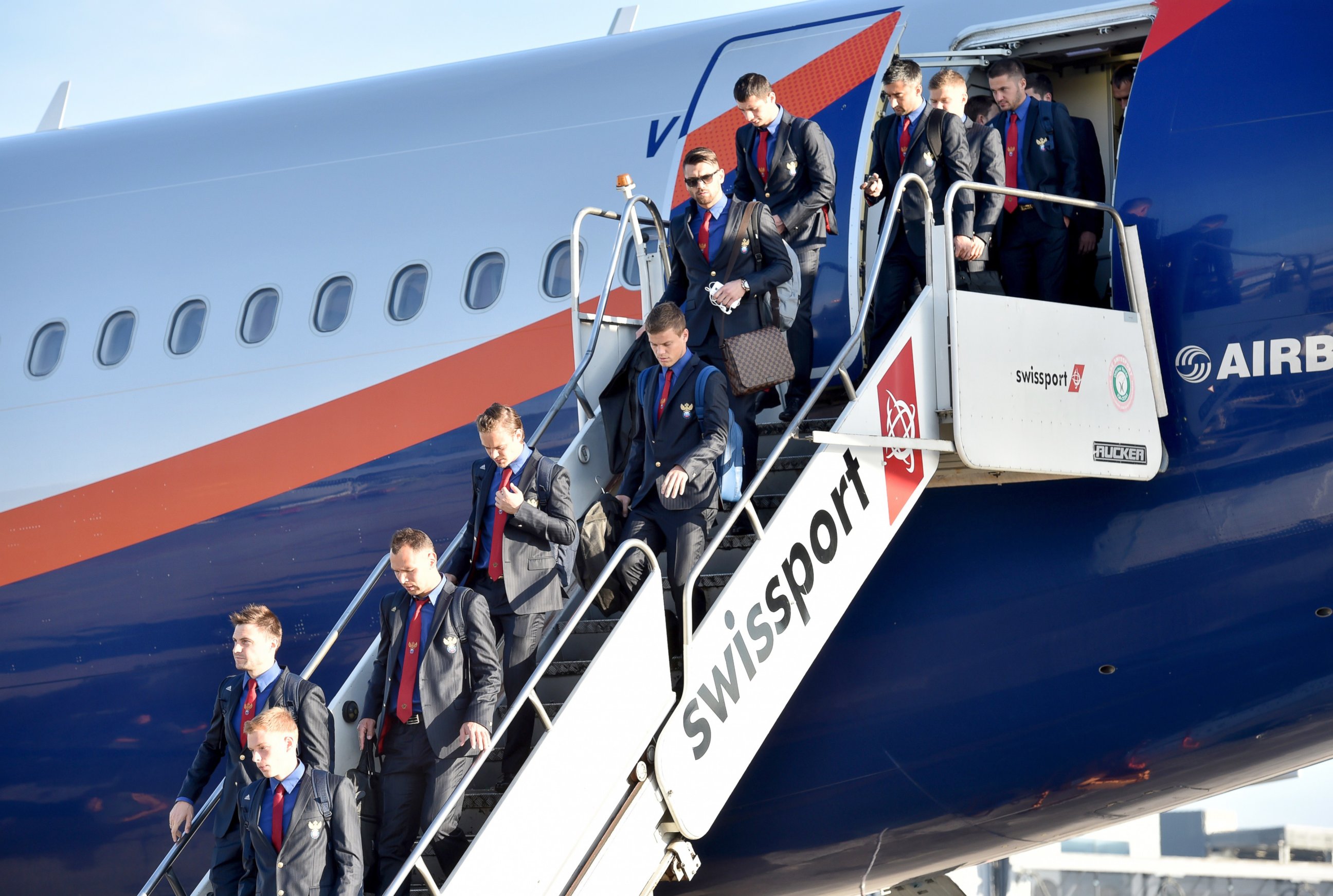 PHOTO: Russia's national football team players get off a plane upon their arrival in Sao Paulo, June 8, 2014, ahead of the 2014 FIFA World Cup in Brazil. 