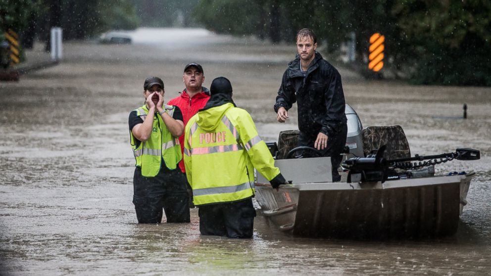 PHOTO: Residents and first responders launch boats to rescue people trapped in their homes, Oct. 4, 2015, in Columbia, S.C.  
