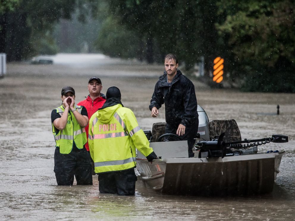 PHOTO: Residents and first responders launch boats to rescue people trapped in their homes, Oct. 4, 2015, in Columbia, S.C.