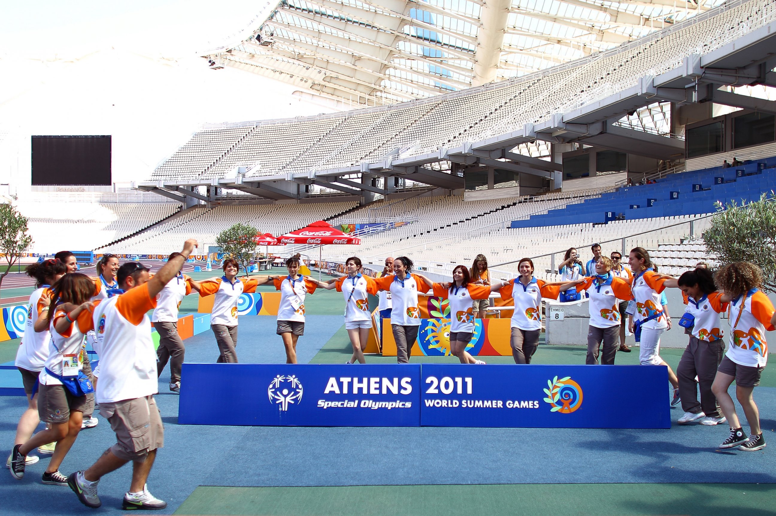 PHOTO: Volunteers dance a traditional Greek dance Syrtaki after the athletics competition of the Athens 2011 Special Olympics World Summer Games in Athens, Greece, June 30, 2011 .  