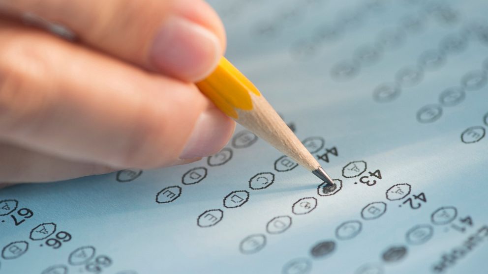 A test form is being filled out in this undated stock image.