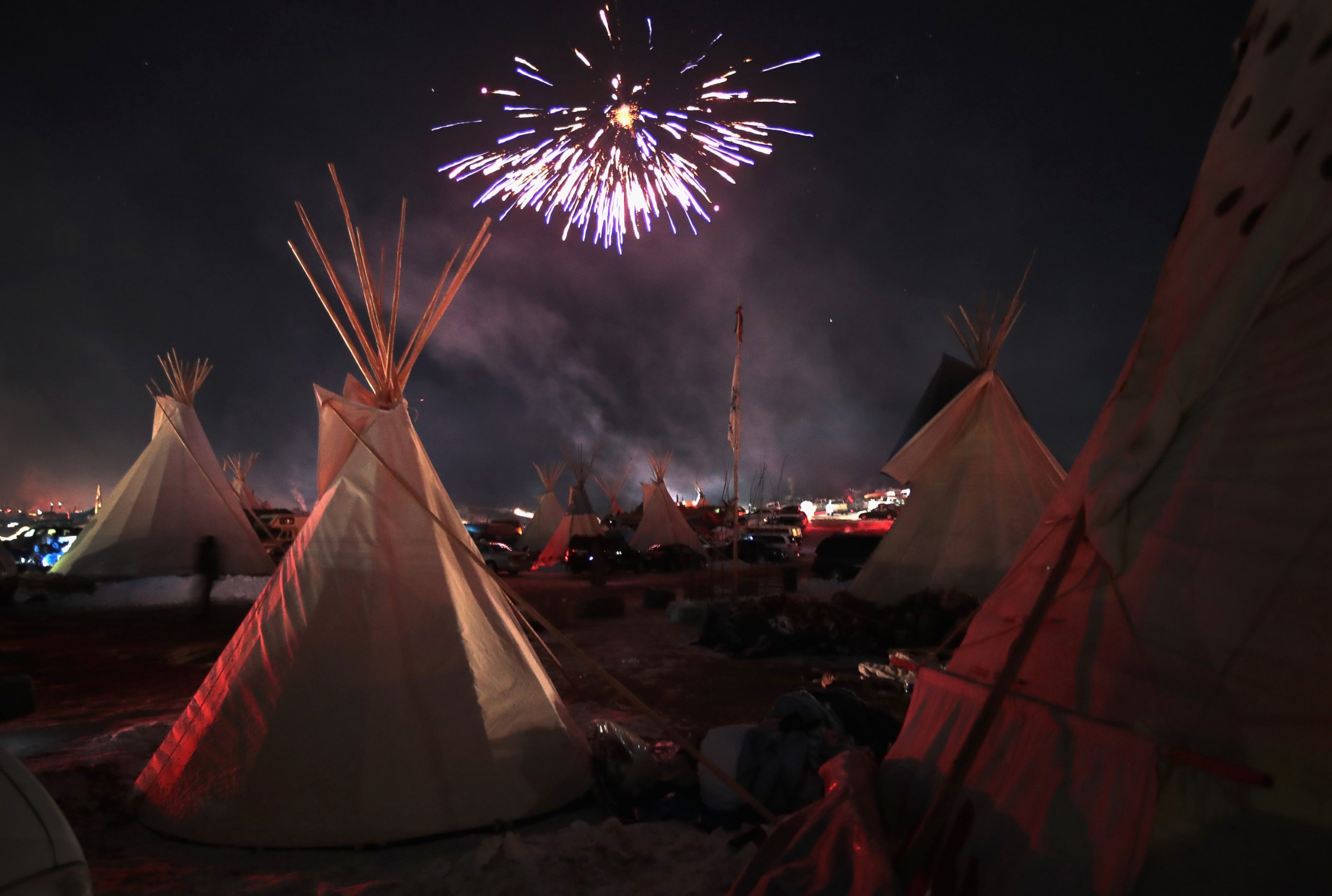 PHOTO: Fireworks fill the sky above Oceti Sakowin Camp as activists celebrate after learning an easement had been denied for the Dakota Access Pipeline near the edge of the Standing Rock Sioux Reservation, Dec. 4, 2016 outside Cannon Ball, North Dakota.