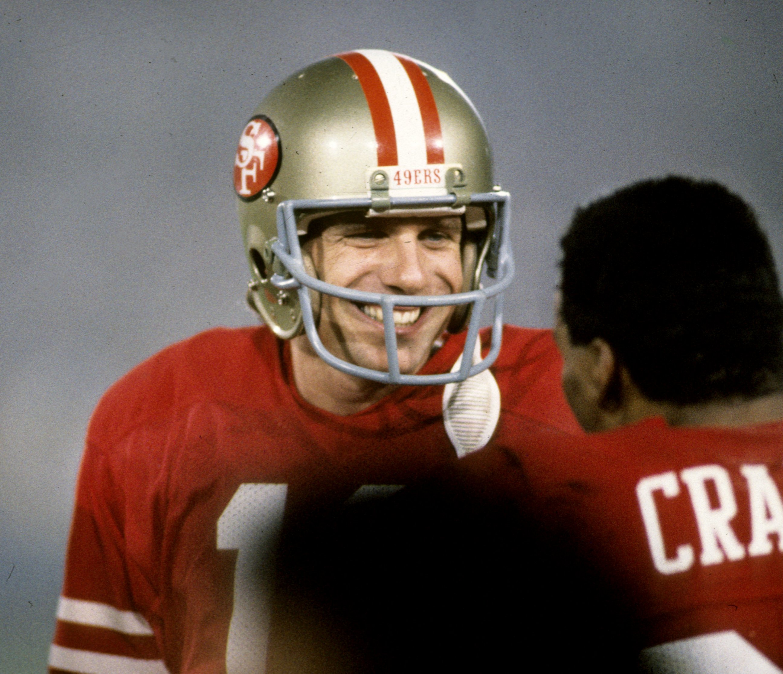 PHOTO: San Francisco 49ers Hall of Fame quarterback Joe Montana is all smiles as he talks to running back Roger Craig during Super Bowl XIX, Jan. 20, 1985, at Stanford Stadium in Stanford, Calif.