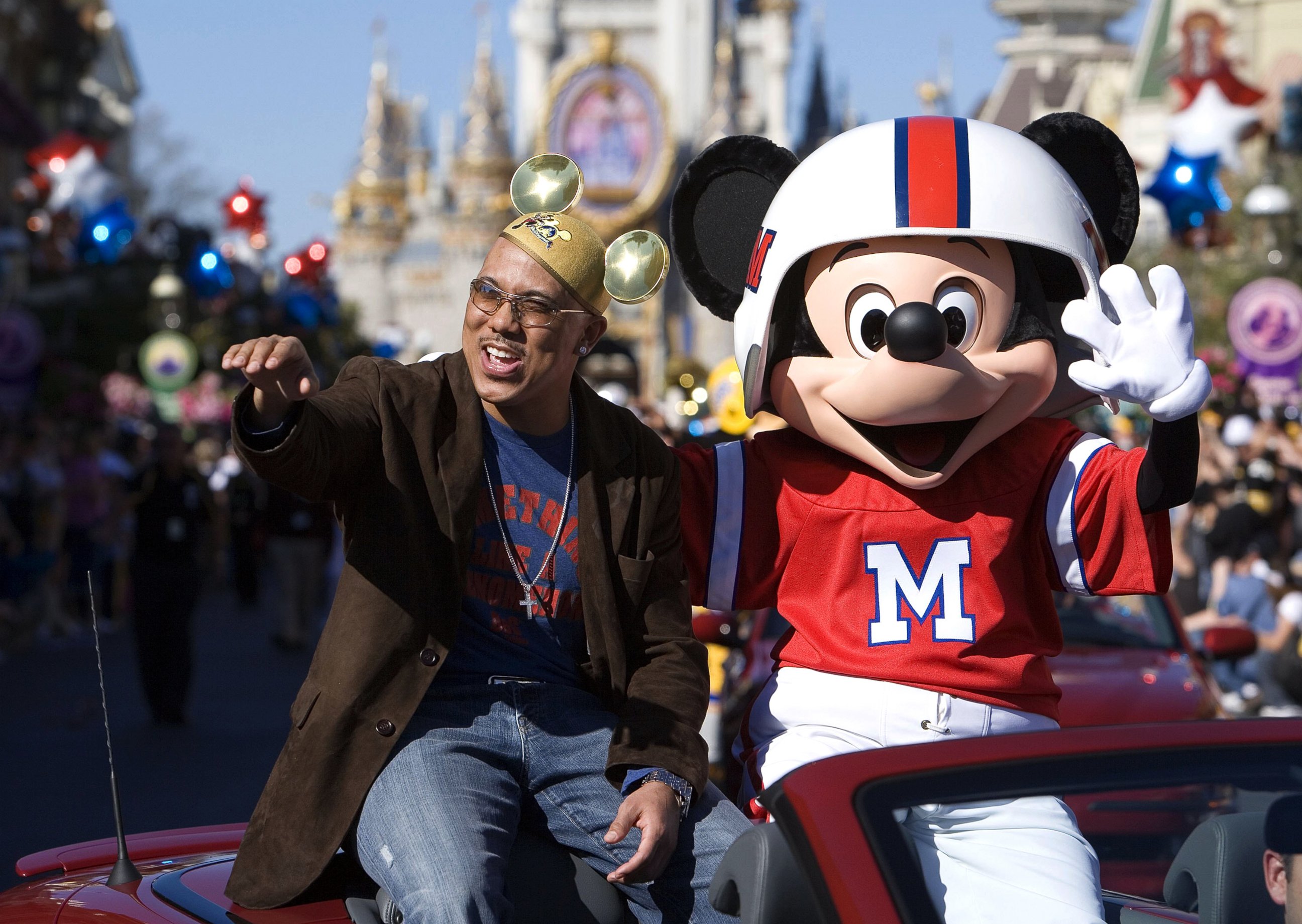 PHOTO: Super Bowl MVP Hines Ward of the Pittsburgh Steelers and Mickey Mouse wave at fans during a parade at Walt Disney World's Magic Kingdom, Feb. 6, 2006 in Lake Buena Vista, Fla. 