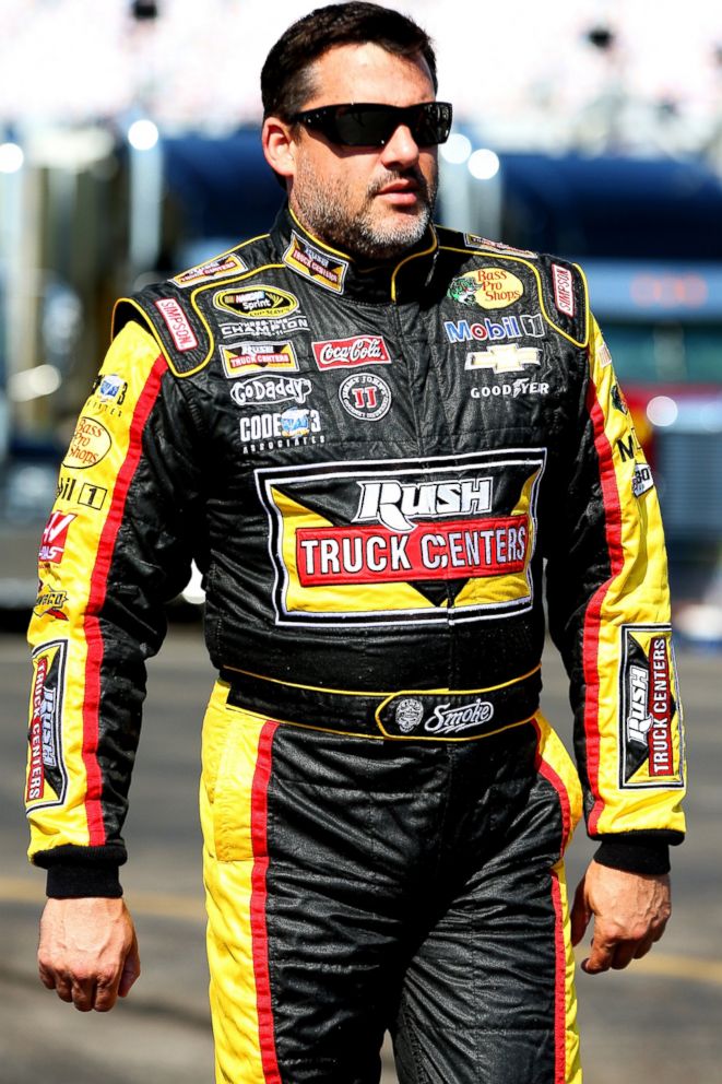PHOTO: Tony Stewart walks in the garage area during practice for the NASCAR Sprint Cup Series Quaker State 400 on June 27, 2014 in Sparta, Ky.  