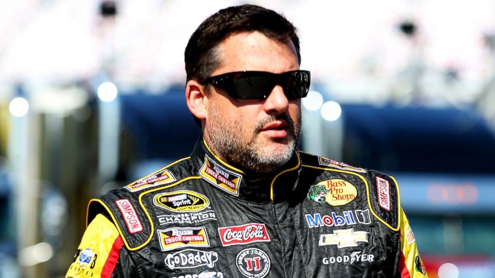 PHOTO: Tony Stewart walks in the garage area during practice for the NASCAR Sprint Cup Series Quaker State 400 on June 27, 2014, in Sparta, Ky. 
