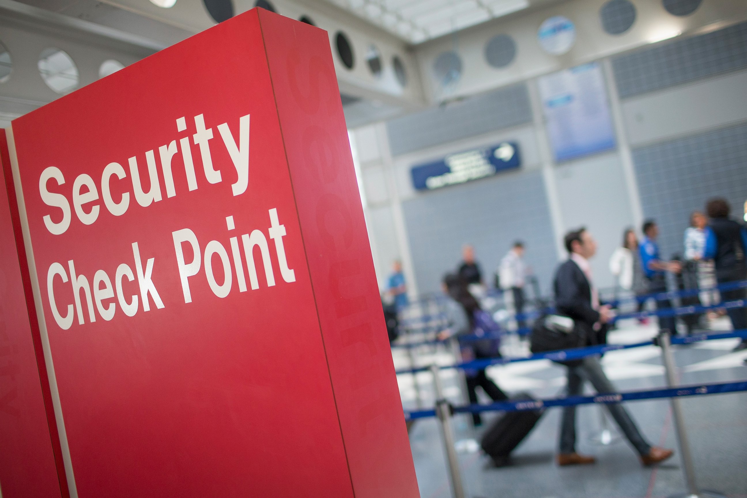 PHOTO: A sign directs travelers to a security checkpoint staffed by Transportation Security Administration workers at O'Hare Airport, June 2, 2015, in Chicago.