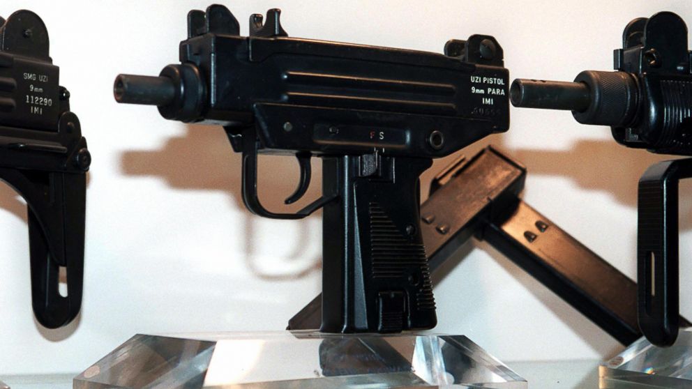 PHOTO: An Uzi pistol,center, is displayed next to the larger Uzi submachine gun models, at the Israeli Military Industries (IMI) in Ramat Hasharon, Israel, Nov. 11, 1997.