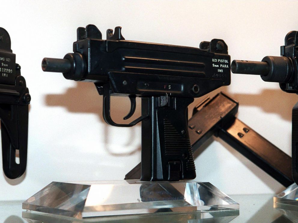 PHOTO: An Uzi pistol,center, is displayed next to the larger Uzi submachine gun models, at the Israeli Military Industries (IMI) in Ramat Hasharon, Israel, Nov. 11, 1997.