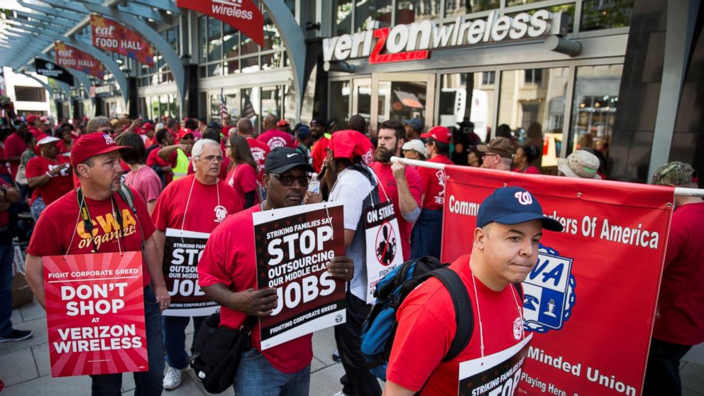 PHOTO: Striking Verizon Wireless workers and members of the Communications Workers of America union march outside of a Verizon Wireless store on F Street in Washington, May 19, 2016.