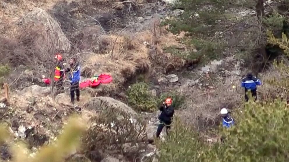 PHOTO:A screengrab taken from an AFP TV video on March 24, 2015 shows search and rescue personnel making their way to the crash site of the Germanwings Airbus A320 that crashed in the French Alps above the southeastern town of Seyne. 