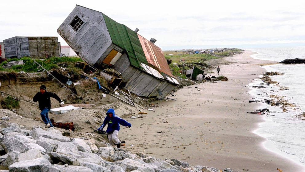 PHOTO: A home destroyed by beach erosion tips over in the the Alaskan village of Shishmaref, Sept. 27, 2006. 