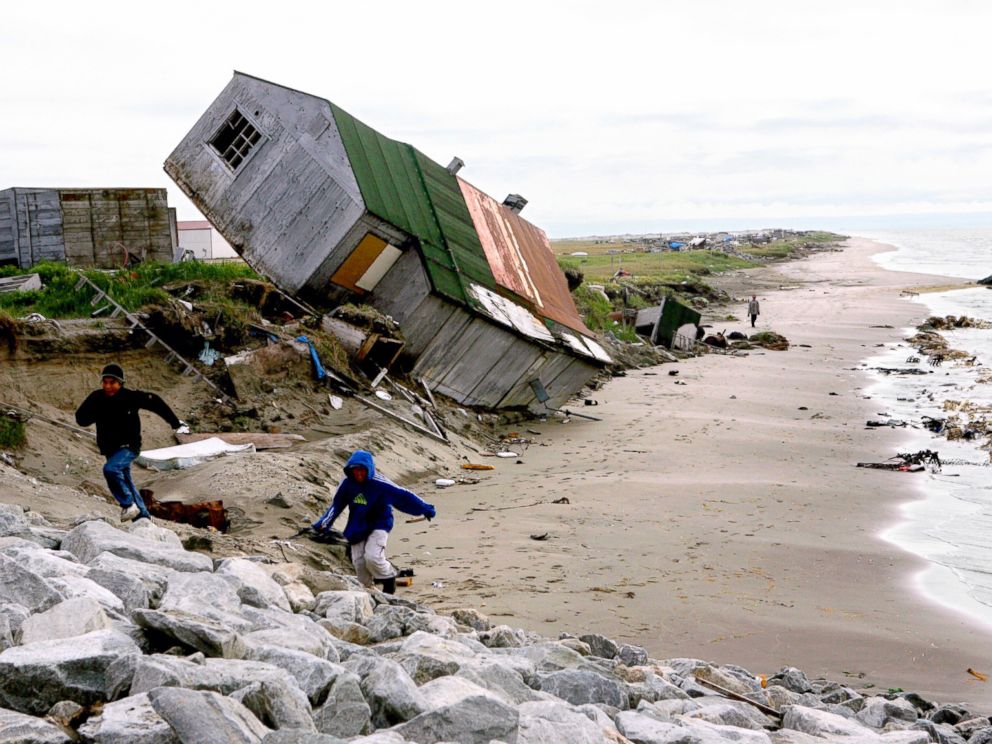 PHOTO: A home destroyed by beach erosion tips over in the the Alaskan village of Shishmaref, Sept. 27, 2006.