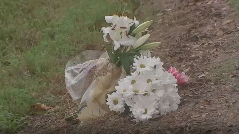 PHOTO: Flowers are placed where a 20-year-old man who survived a crash into a utility pole died after he was electrocuted when stepping out of his vehicle and onto the downed power line in Texas City, Texas, on Feb. 8, 2020.