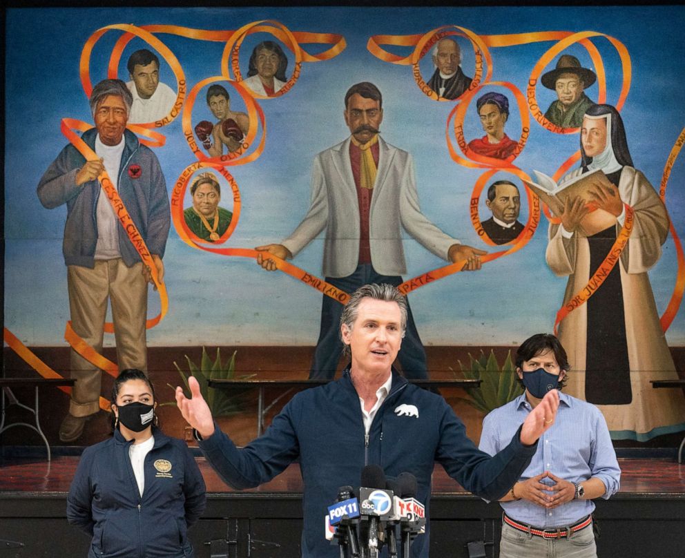 PHOTO: California Gov. Gavin Newsom, center visits the Ramona Gardens Recreation Center in Los Angeles to discuss the state's efforts to vaccinate hard-to-reach and disproportionately impacted communities in Los Angeles Sunday, Feb. 21, 2021. 