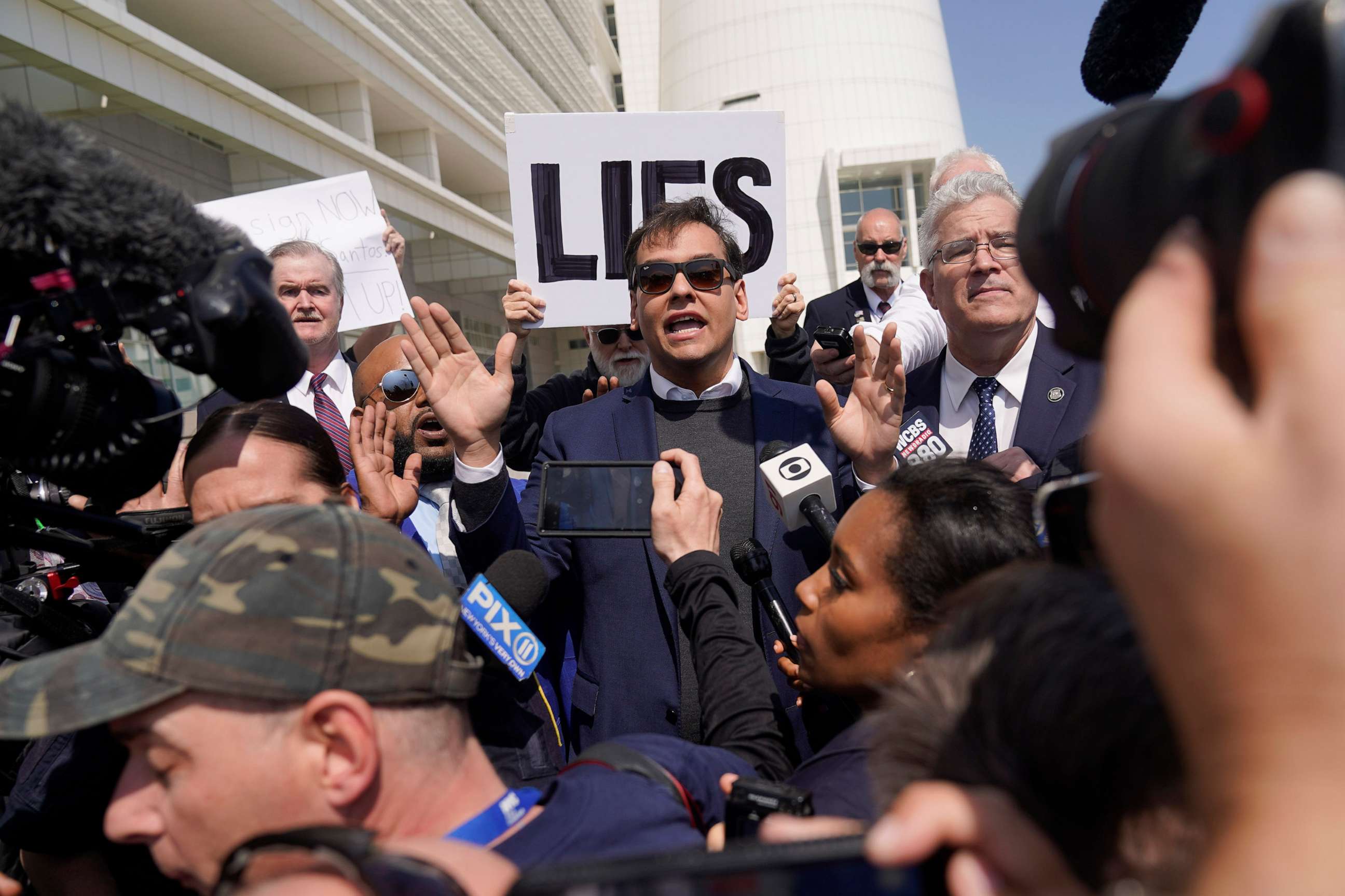 PHOTO: U.S. Rep. George Santos speaks to reporters outside of the federal courthouse in Central Islip, N.Y., May 10, 2023.