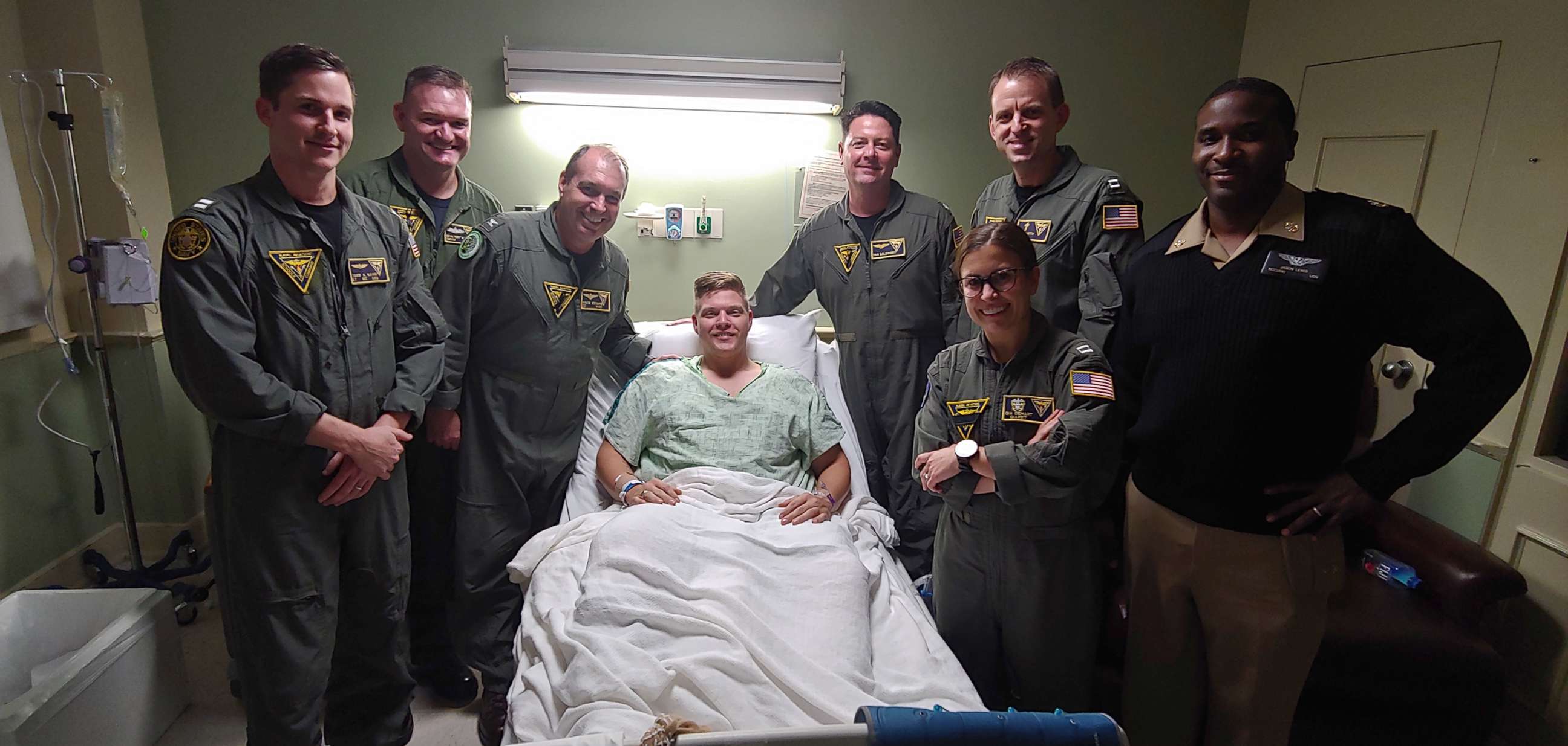 PHOTO: Then-airman George Johnson surrounded by friends while he was in the hospital recovering from the Dec. 6, 2019, attack.