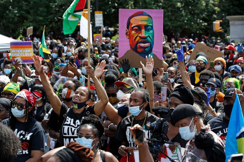 PHOTO: FILE - In this June 14, 2020, file photo, people participate in a Caribbean-led Black Lives Matter rally at Brooklyn's Grand Army Plaza in New York. 