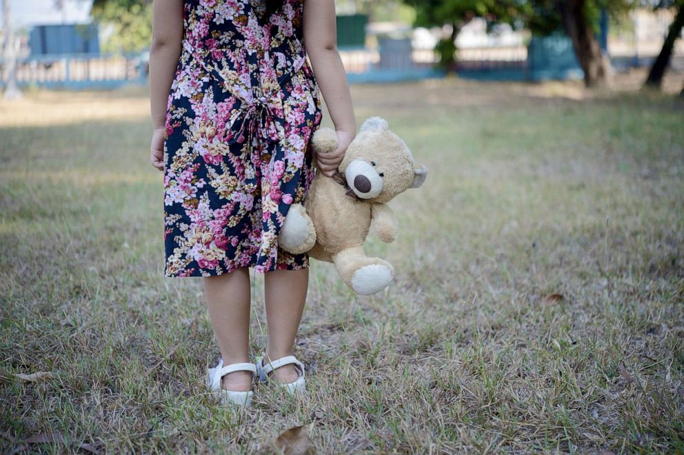 PHOTO: Girl with teddy bear. 