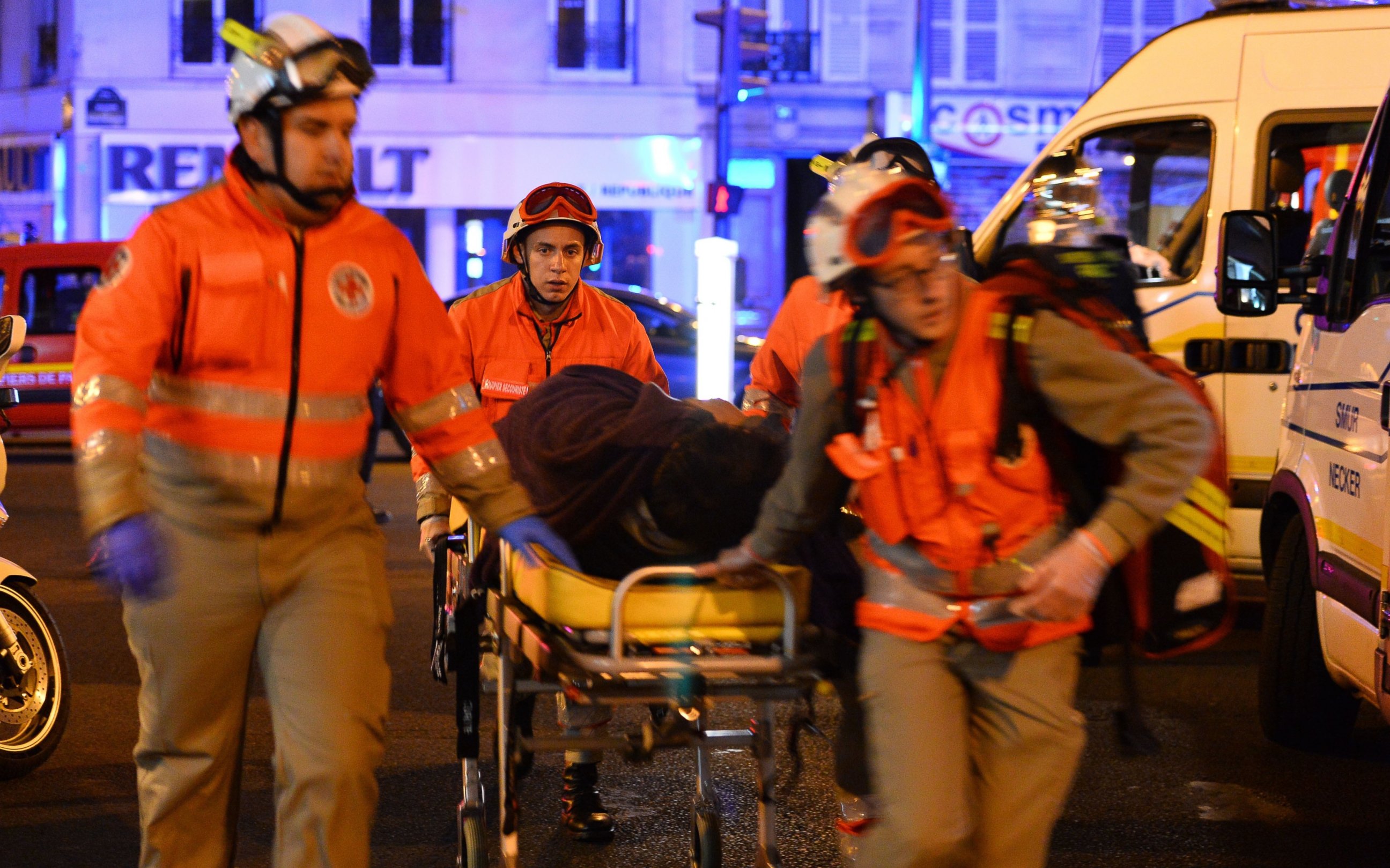 PHOTO: Medics carry wounded people to ambulances near Le Petit Cambodge restaurant in the 11th district after a  shooting, Nov. 14, 2015, Paris. 