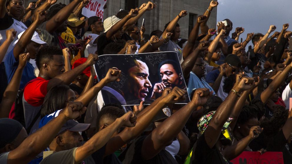 Demonstrators gather after marching at the Louisiana Capitol to protest the shooting of Alton Sterling on July 9, 2016 in Baton Rouge, Louisiana. 
