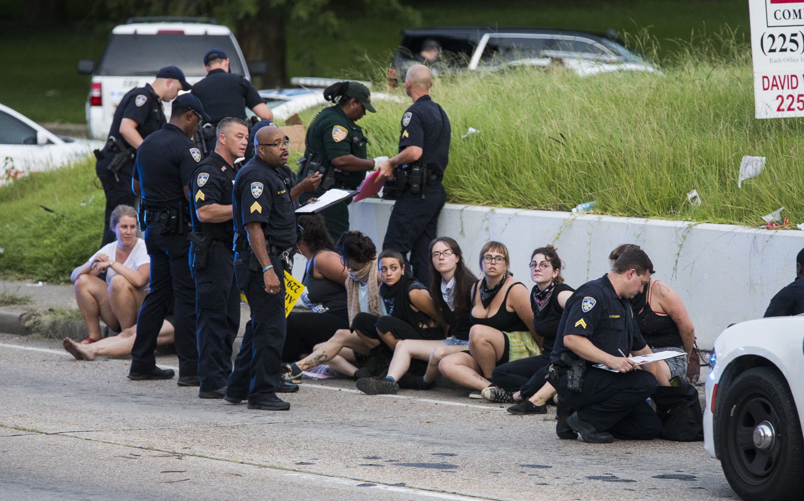 PHOTO: Several arrested protesters get processed on the scene after a march on July 10, 2016 in Baton Rouge, Louisiana. 