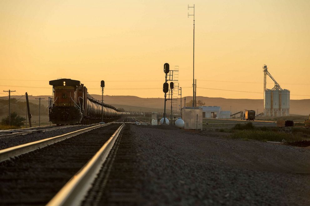PHOTO: FILE - Train cars travel eastbound paralleling Hwy 2 in the Bakken oil field near Bainville, Montana Sept 11, 2013.