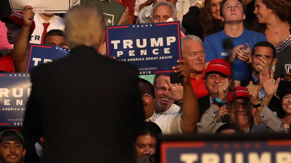 FORT LAUDERDALE, FL - AUGUST 10: Former Congressman Mark Foley (red shirt middle of frame) sits in the audience as Republican presidential nominee Donald Trump looks back at the crowd during his campaign event at the BB&T Center on August 10, 2016 in Fort Lauderdale, Florida. Trump continued to campaign for his run for president of the United States.  (Photo by Joe Raedle/Getty Images)