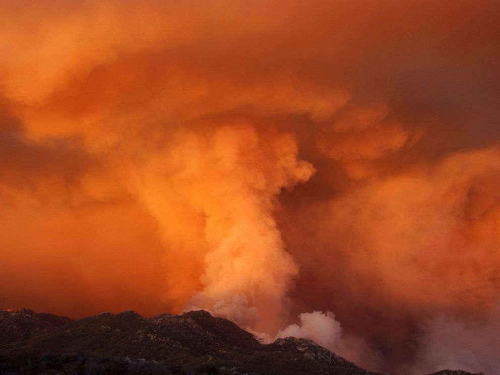 PHOTO: Smoke takes on the appearance of a colossal tornado as it rises from upper Borrego Palm Canyon in the Anza-Borrego Desert State Park near the boundary of the Los Coyotes Indian Reservation August 7, 2002 west of Borrego Springs, California.