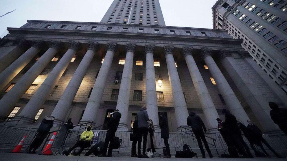 PHOTO: People line up to enter the court for the second day of the Ghislaine Maxwell trial in New York, Nov. 30, 2021.