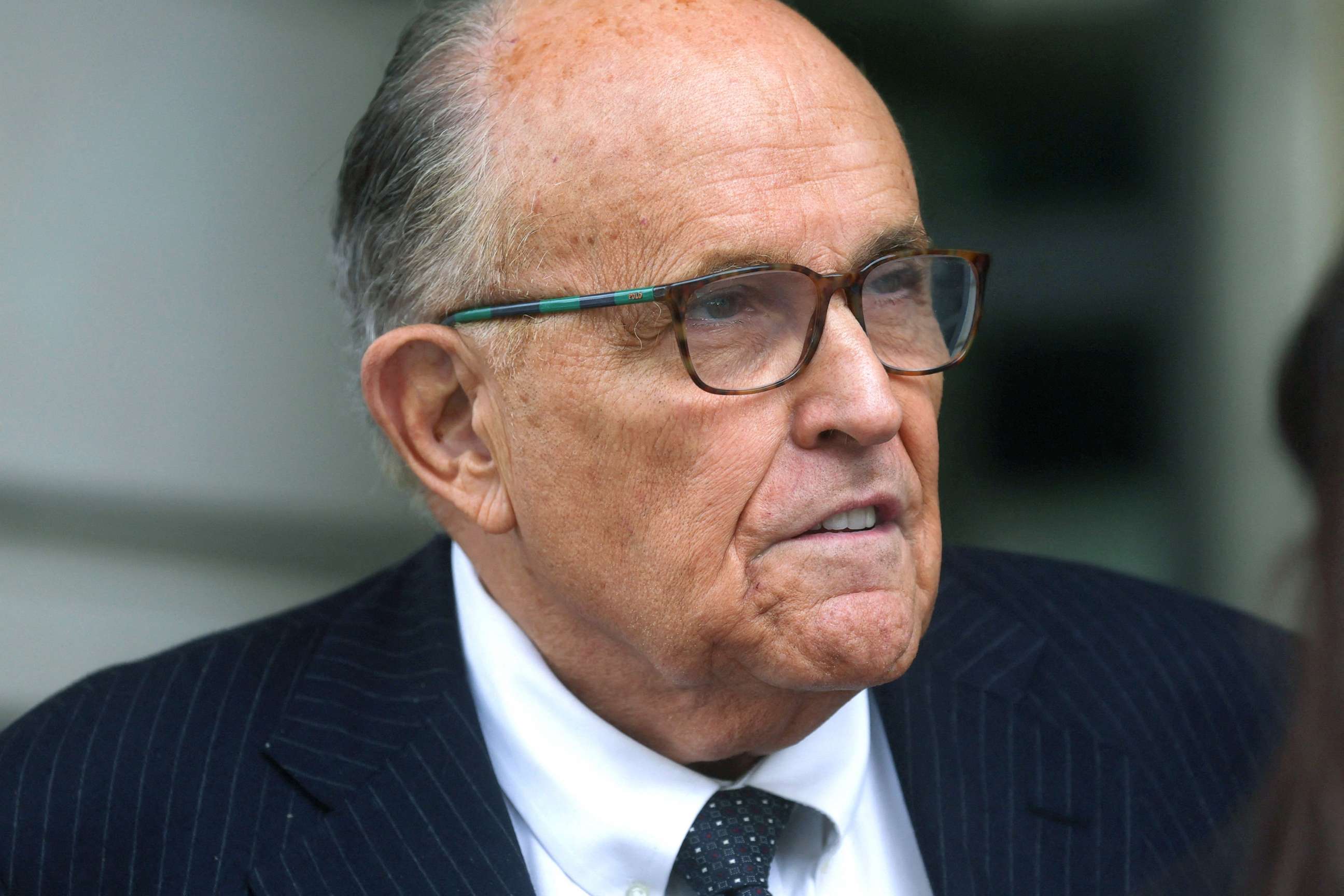 PHOTO: Former New York City Mayor Rudy Giuliani, an attorney for former President Donald Trump during challenges to the 2020 election results, exits U.S. District Court after attending a hearing at the federal courthouse in Washington, D.C., May 19, 2023.