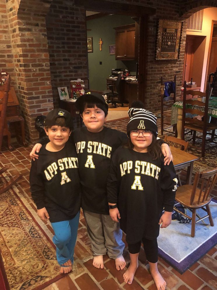 PHOTO: After a weeks-long battle with COVID-19, Dr. Grant Lashley reunited with his children, 9-year-old Wyatt (center) and 7-year-old twins Cody (left) and Weston (right).