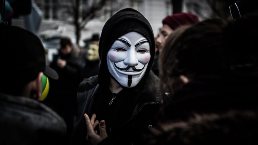 PHOTO: A person wears a Guy Fawkes mask, a trademark and symbol for the online hacktivist group Anonymous, Feb. 25, 2012. 