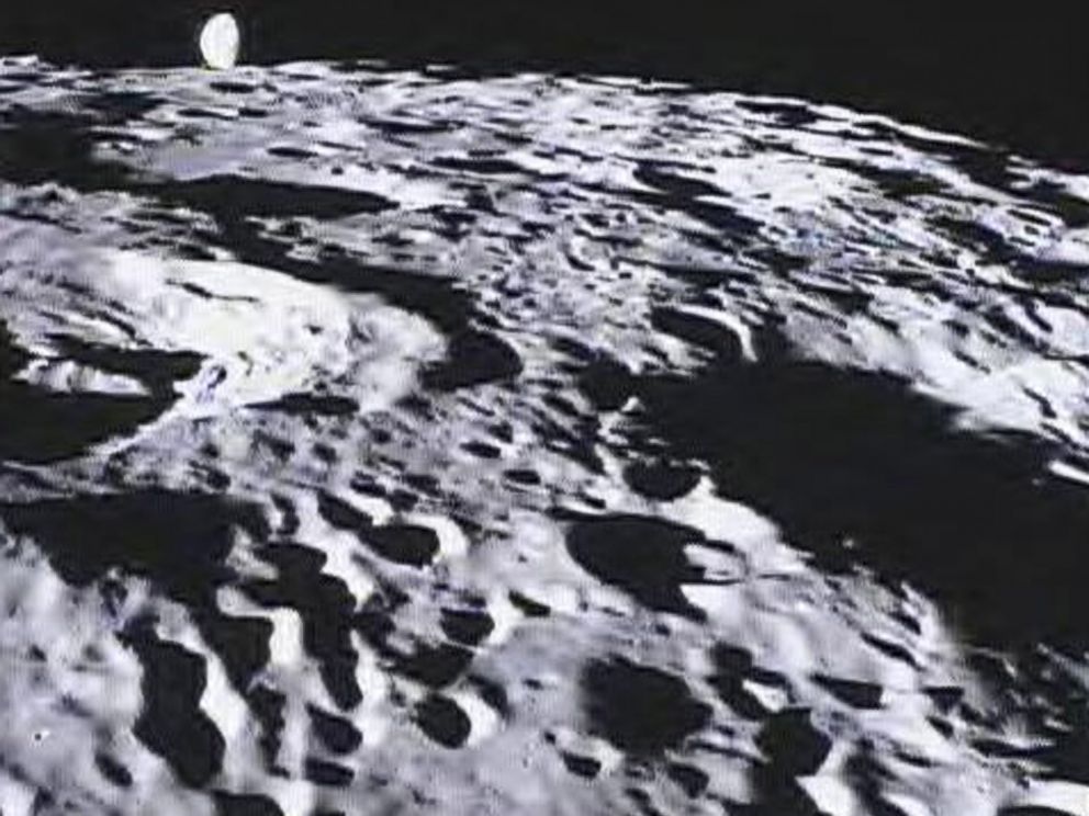 PHOTO: Image of the far side of the lunar surface, with Earth in the background, taken by NASAs MoonKAM system onboard the Ebb spacecraft.